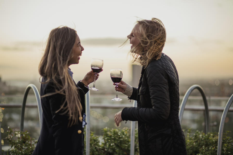 Pictured: Young women sharing a drink on a Friday. Images: Getty