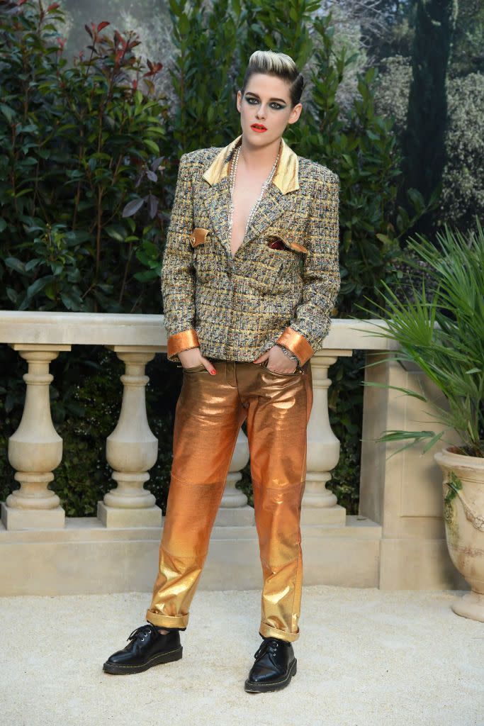 <p>Stewart paired metallic trousers with a tweed jacket and black brogues to the Chanel Haute Couture show in January 2019.</p>