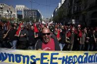 Protesters from the Communist-affiliated trade union PAME shout slogans as they march towards the parliament during a general labour strike in Athens April 9, 2014. REUTERS/Alkis Konstantinidis