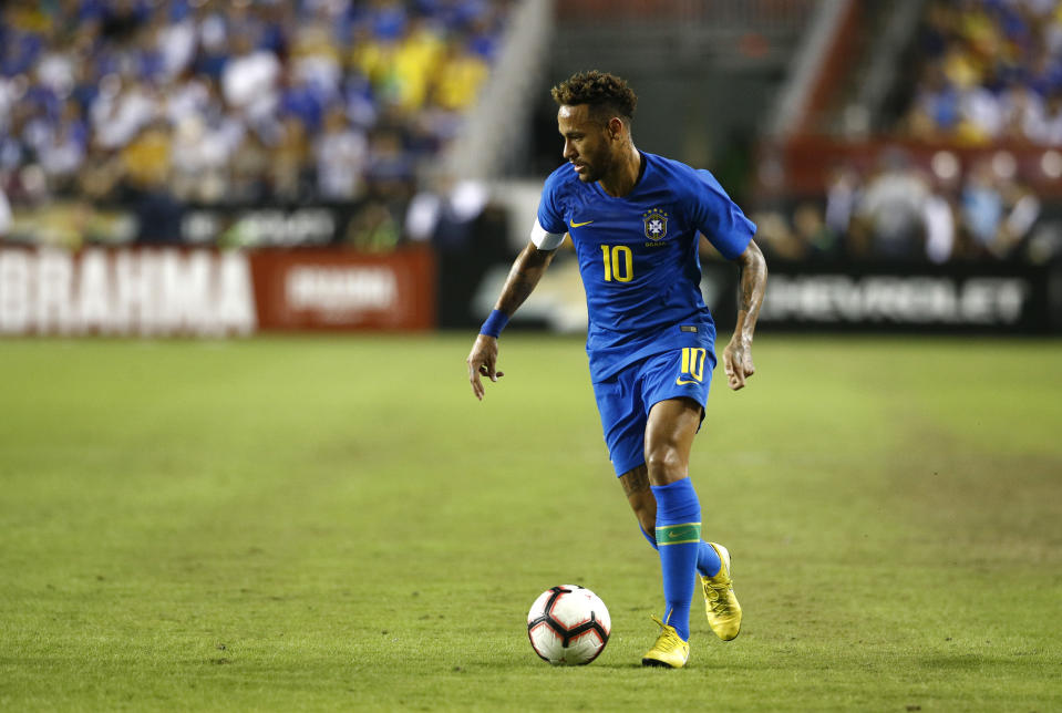 FILE - In this file photo dated Tuesday, Sept. 11, 2018, Brazil forward Neymar dribbles the ball in the first half of a soccer match against El Salvador, in Landover, USA. PSG has taken exception to a questionnaire by RTL radio, asking soccer fans if they think Neymar causes his own injury problem with a provocative style of play. Paris Saint-Germain attacking star Neymar is recovering from his third injury in the last 12 months. (AP Photo/Patrick Semansky, FILE)