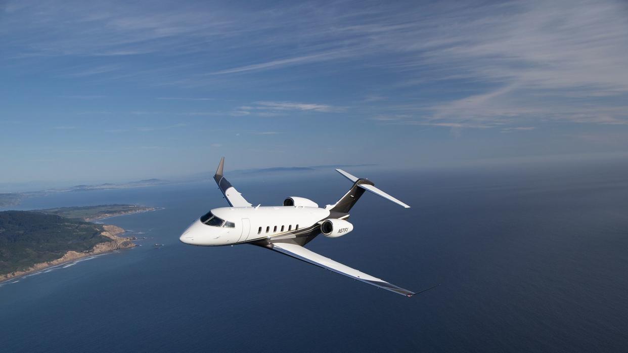 A Flexjet private plane flying over ocean