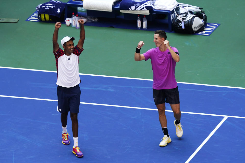 Rajeev Ram, of the United States, left, and Joe Salisbury, of Britain, celebrate after defeating Wesley Koolhof, of the Netherlands, and Neal Skupski, of Britain, in the final of the men's doubles at the the U.S. Open tennis championships, Friday, Sept. 9, 2022, in New York. (AP Photo/Matt Rourke)