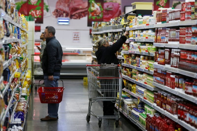 Customers shop inside a supermarket in Beirut