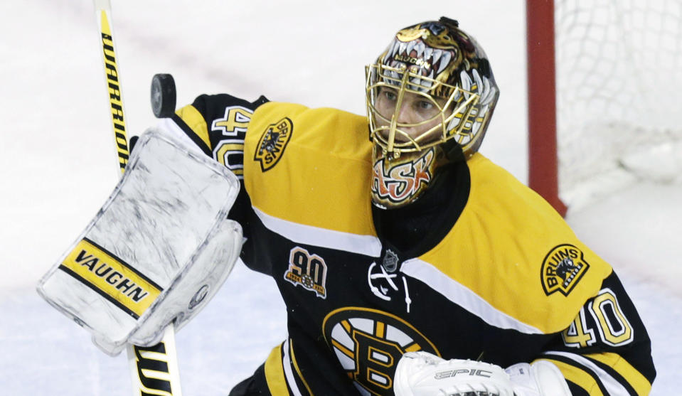 Boston Bruins goalie Tuukka Rask (40) keeps his eyes on the puck as he makes a save against the Montreal Canadiens during the second period of Game 1 in the second-round of a Stanley Cup playoff series in Boston, Thursday, May 1, 2014. (AP Photo/Charles Krupa)