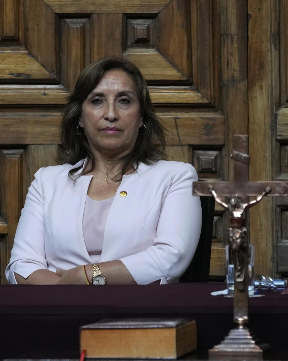 Peru's President Dina Boluarte attends a ceremony at the Foreign Ministry in Lima, Peru, Tuesday, Dec. 20, 2022. Peru's Congress is slated to consider a proposal on Tuesday to push up elections that have been a major demand of protesters blocking highways and clashing with security forces in deadly demonstrations across the country over the ouster of ex-President Pedro Castillo. (AP Photo/Martin Mejia)