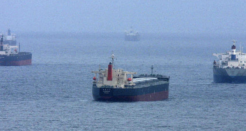 Coal tankers are seen waiting offshore.