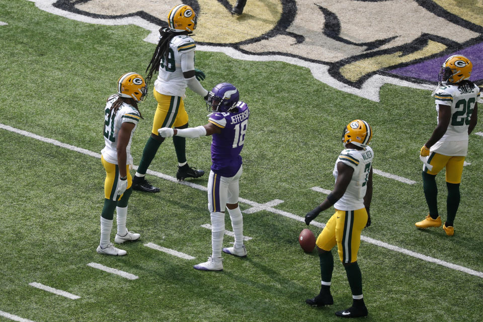 Minnesota Vikings wide receiver Justin Jefferson (18) celebrates after catching a pass for a first down during the first half of an NFL football game against the Green Bay Packers, Sunday, Sept. 11, 2022, in Minneapolis. (AP Photo/Bruce Kluckhohn)