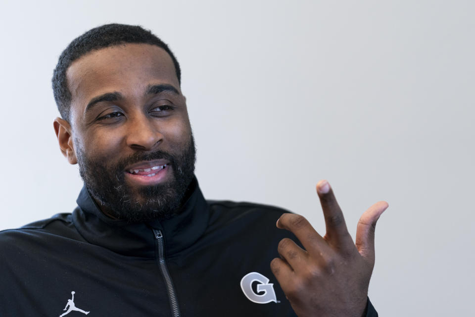 Georgetown NCAA college basketball assistant coach LaDontae Henton speaks during an interview, Thursday, Oct. 19, 2023, in Washington. (AP Photo/Stephanie Scarbrough)