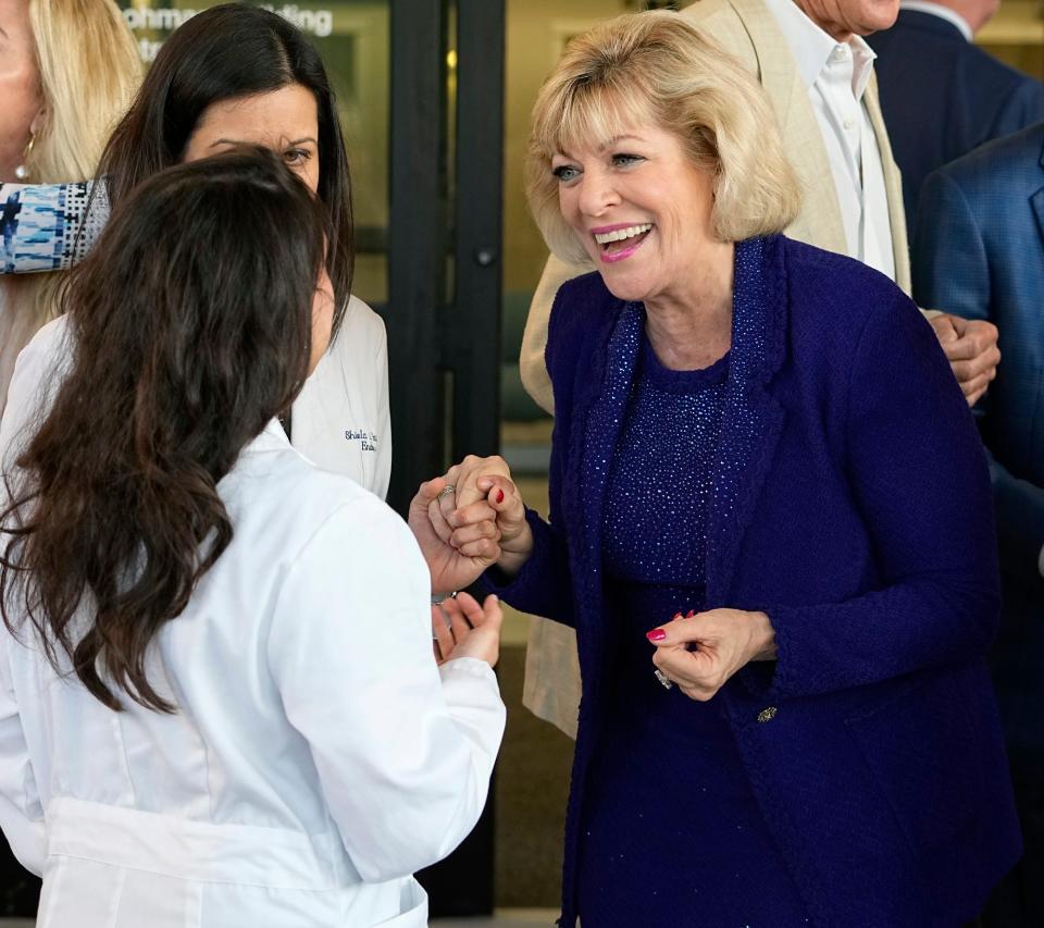Nancy Lohman during greets staff at a ribbon cutting ceremony for the Lohman Building at Halifax Health in Daytona Beach on Friday.