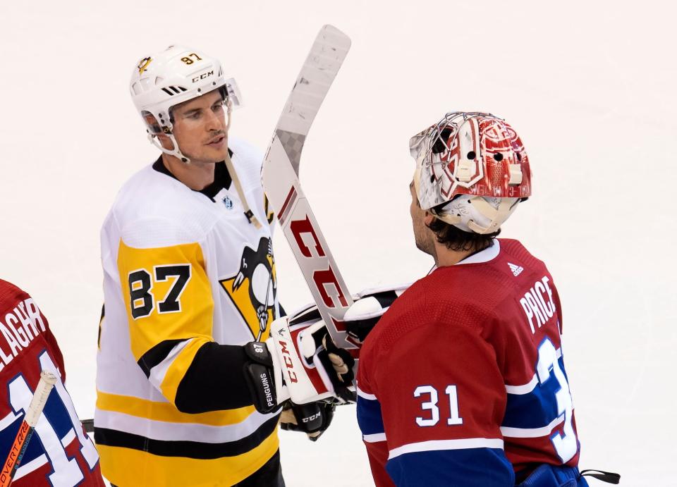 Pittsburgh Penguins center Sidney Crosby congratulates Montreal Canadiens goaltender Carey Price after Game 4.