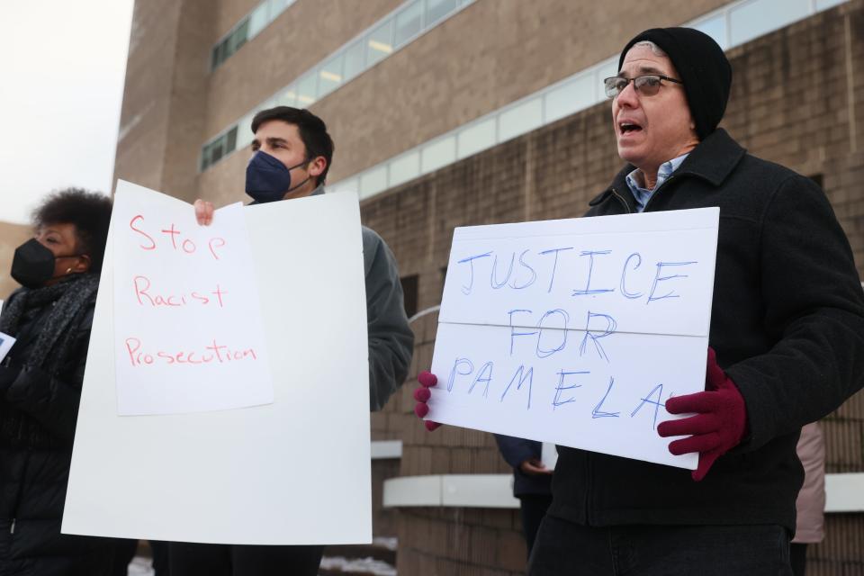 Steve Mulroy, right, and Jeffrey Lichtenstein join a a group gathered outside of 201 Poplar on Friday Feb. 4, 2022 in protest of Pamela Moses' conviction and sentencing to six years in prison on charges of illegally registering to vote. "This is the clearest example of prosecutorial overreach that you could possibly identify," said Mulroy, a law professor at the University of Memphis specializing in election and criminal law.