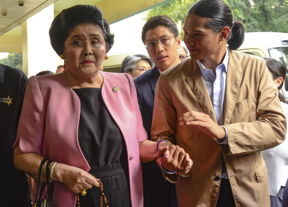 Former Philippine First Lady Imelda Marcos arrives at an anti-graft court Sandiganbayan to explain her side for not attending last week's promulgation of the graft charges against her Friday, Nov. 16, 2018 in suburban Quezon city northeast of Manila, Philippines. A Philippine court found Imelda Marcos guilty of graft and ordered her arrest last week in a rare conviction among many corruption cases that she's likely to appeal to avoid jail and losing her seat in Congress. (AP Photo/Maria S. Tan)