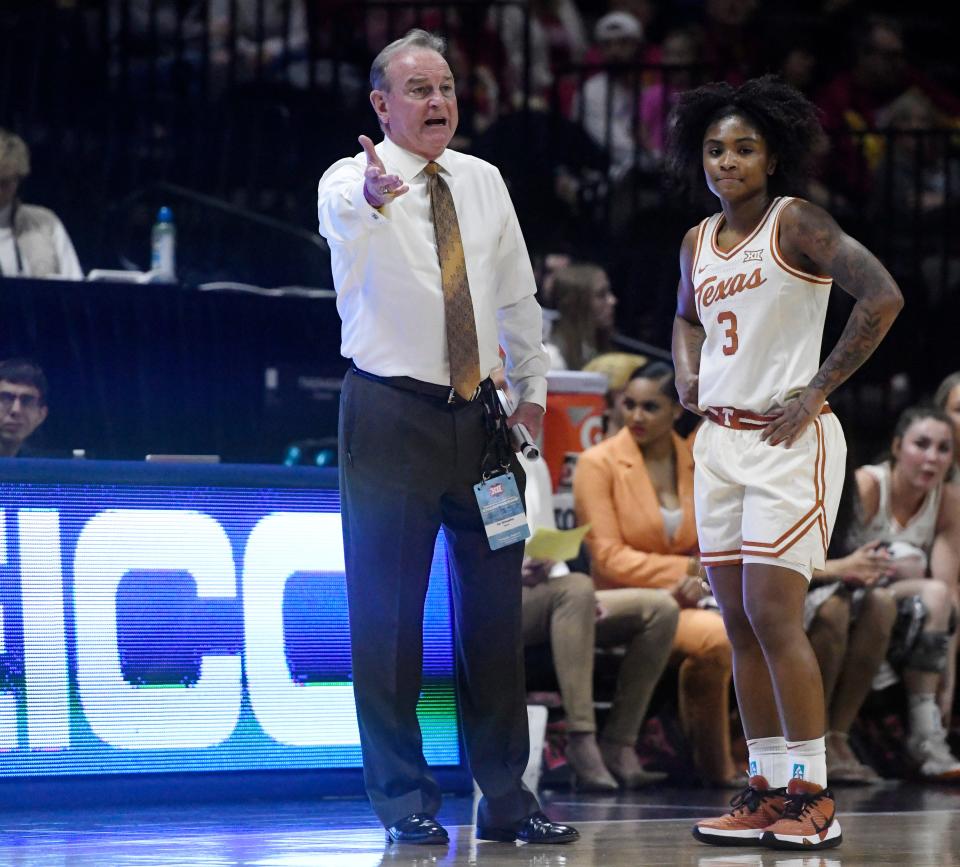 Texas coach Vic Schaefer speaks to point guard Rori Harmon during last week's Big 12 tournament in Kansas City. Harmon missed Texas' first five games of the season, one of several significant injures Schaefer has had to navigate. "You kind of, just have to deal with what you have and everybody is very capable of doing what they can do and giving to the team," Harmon said.