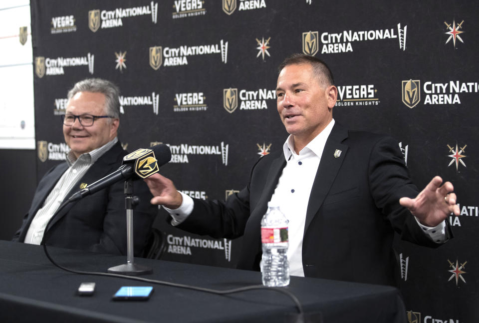 Bruce Cassidy, right, new head coach of the Vegas Golden Knights, responds to a question during an NHL hockey news conference at City National Arena in Las Vegas, Thursday, June 16, 2022. At left is general manager Kelly McCrimmon. (Steve Marcus/Las Vegas Sun via AP)