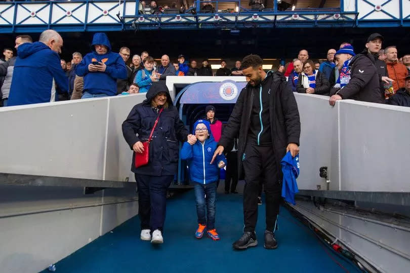 Connor Goldson of Rangers walks out the tunnel with Iain Norrie (8) at half time during the Scottish Premiership match at Ibrox Stadium, Glasgow.