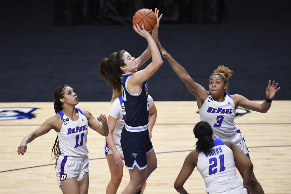 Villanova's Maddy Siegrist shoots over DePaul's Deja Church (3) during overtime of an NCAA college basketball game in the quarterfinals of the Big East Conference tournament at Mohegan Sun Arena, Saturday, March 6, 2021, in Uncasville, Conn. (AP Photo/Jessica Hill)