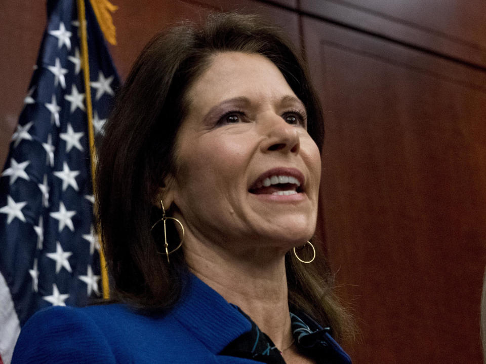 FILE - This Dec. 6, 2017 file photo shows Rep. Cheri Bustos, D-Ill., during a news conference on Capitol Hill in Washington. Voters will decide whether to reward or punish incumbents for their choices. And while Republicans and Democrats acknowledge that other issues like the economy and health care costs could overwhelm impeachment by next November, both sides, but especially the GOP , are already using the bitter impeachment fight as weapons. (AP Photo/Andrew Harnik, File)