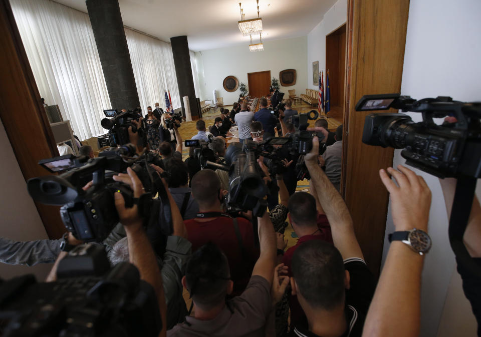 US President Donald Trump's envoy for Serbia-Kosovo talks Richard Grenell speaks with Serbian President Aleksandar Vucic at the Serbia Palace in Belgrade, Serbia, Tuesday, Sept. 22, 2020. Trump's administration has been working to normalize relations between Serbia and Kosovo, two former Balkan war foes, and two weeks ago Serbian President Aleksander Vucic and Kosovo Prime Minister Avdullah Hoti signed an economic normalization deal at the White House. (AP Photo/Darko Vojinovic)