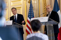 US Secretary of State Antony Blinken, left, accompanied by French Foreign Affairs Minister Jean-Yves Le Drian, right, speaks at a news conference at the French Ministry of Foreign Affairs in Paris, Friday, June 25, 2021. Blinken is on a week long trip in Europe traveling to Germany, France and Italy. (AP Photo/Andrew Harnik, Pool)