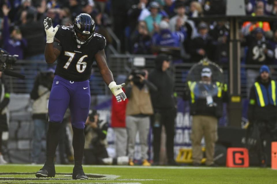 Dec 31, 2023; Baltimore, Maryland, USA; Baltimore Ravens guard John Simpson (76) reacts after running back Gus Edwards (35) touchdown against the Miami Dolphins during the first half at M&T Bank Stadium. Mandatory Credit: Tommy Gilligan-USA TODAY Sports