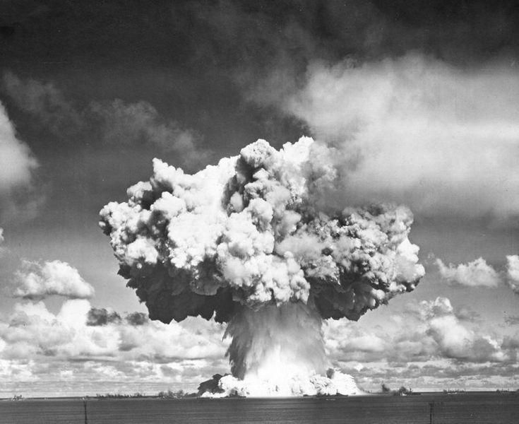 The Wilson cloud has evaporated revealing the cauliflower atop the spray column. Two million tons of water spray fall back into the lagoon. The radioactive base surge is moving toward the ships. Operation Crossroads "Baker" shot, 1946, Bikini Atoll. (Image courtesy of US Govt. Defense Threat Reduction Agency.)