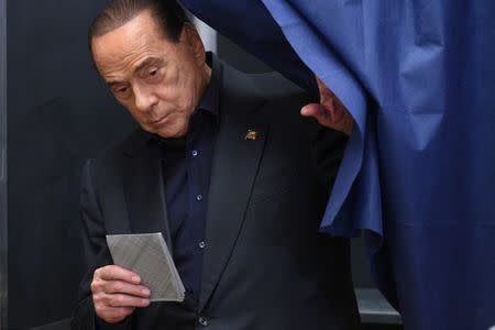Silvio Berlusconi, former Italian prime minister and leader of Forza Italia (Go Italy!) party, casts his vote in the European Parliament election in Milan, Italy May 26, 2019. REUTERS/Guglielmo Mangiapane