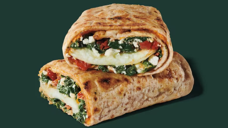 Spinach, feta, and egg white wrap against green background
