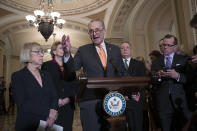 Senate Minority Leader Chuck Schumer, D-N.Y., Sen. Patty Murray, D-Wash., Sen. Debbie Stabenow, D-Mich., and Sen. Dick Durbin, D-Ill., the assistant Democratic leader, talks to reporters about the possibility of a partial government shutdown, at the Capitol in Washington, Tuesday, Dec. 18, 2018. Congress and President Donald Trump continue to bicker over his demand that lawmakers fund a wall along the U.S.-Mexico border, pushing the government to the brink of a partial shutdown at midnight Friday. (AP Photo/J. Scott Applewhite)