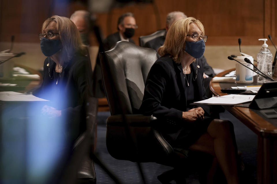 Sen. Maggie Hassan, D-N.H., listens to Surgeon General Jerome Adams give an opening statement during a Senate Health, Education, Labor and Pensions Committee hearing to discuss vaccines and protecting public health during the coronavirus pandemic on Capitol Hill, Wednesday, Sept. 9, 2020, in Washington. (Greg Nash/Pool via AP)