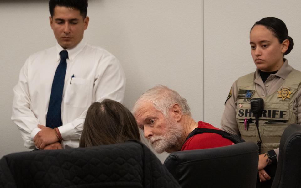 George Alan Kelly (center) talks with his attorney Brenna Larkin (left) during his preliminary hearing on Feb. 22, 2023, in Nogales.