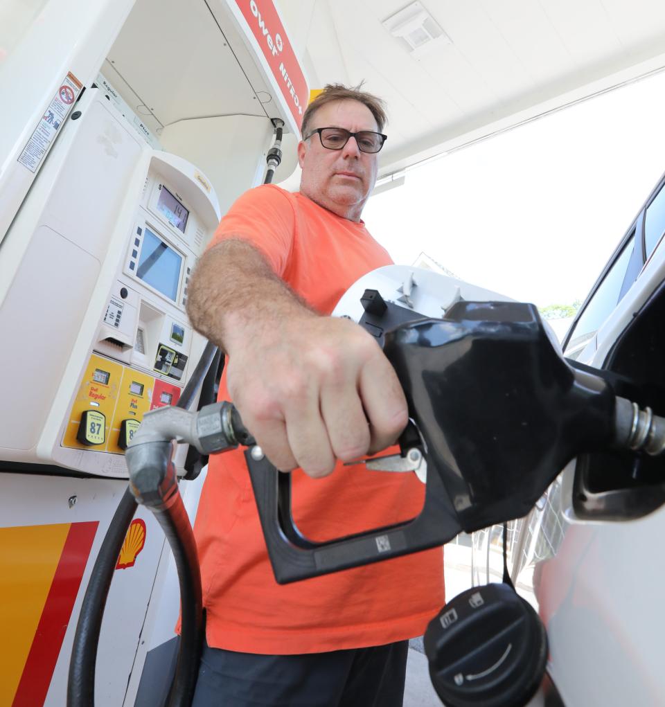 Frank White gets gas at a Shell station in Orangeburg, New York, in May.