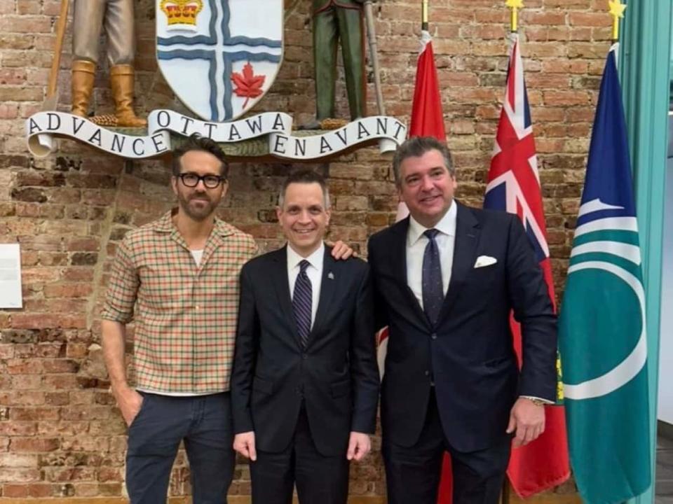 Ryan Reynolds posted this photo of himself and Ottawa Mayor Mark Sutcliffe on Instagram on Thursday. Reynolds is reported to be part of a group that's among those interested in purchasing the Ottawa Senators. At far right is Chris Bratty, president of The Remington Group, the Toronto real estate company with whom Reynolds is reportedly teaming up to bid on the Senators.  (Ryan Reynolds/Instagram - image credit)