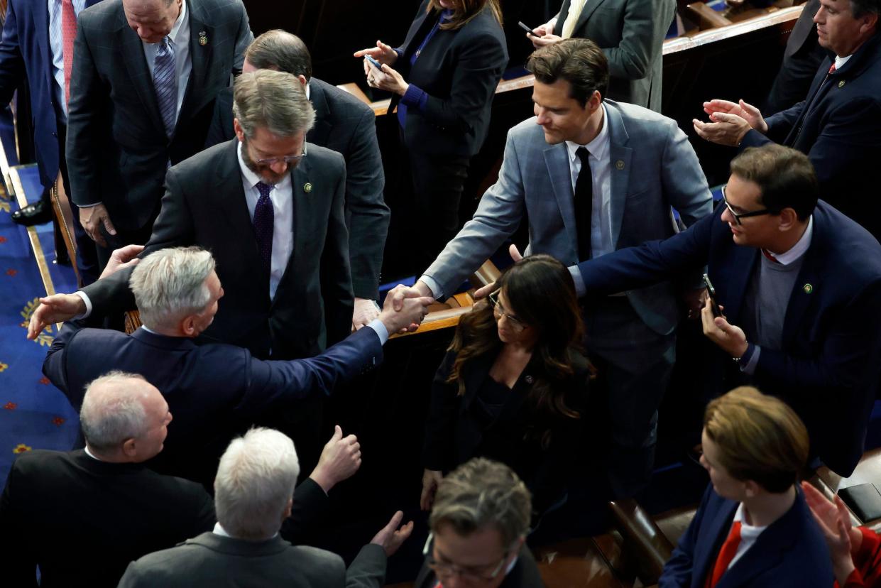 Republican Rep. Matt Gaetz of Florida (R) shakes hands with newly elected Speaker Kevin McCarthy at the US Capitol on January 7, 2023.