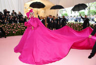 <p> There are layered looks on the Met Gala every year, but because Lady Gaga is always pulling out all the stops, her Brandon Maxwell look encompassed a grand total of <em>four </em>different looks. (If you missed the original debut, go to YouTube and watch—you won't be disappointed.) We started with this huge pink gown with a 25(!) foot train, then that came off to reveal a corseted black dress, then THAT came off to reveal a bright pink column dress. And then! She stripped down to black crystal bra, underwear, and mega platform boots. Only Gaga! </p>