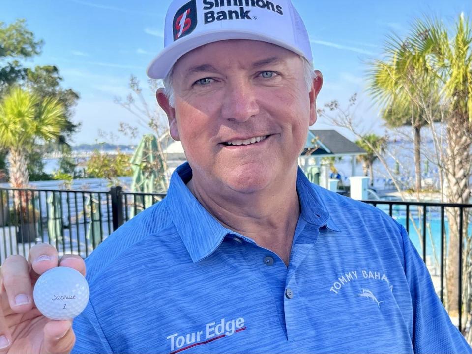 Ken Duke displays the Titleist 1 ball he used to make a hole-in-one at No. 17 of the Timuquana Country Club on Saturday in the second round of the Constellation Furyk & Friends.