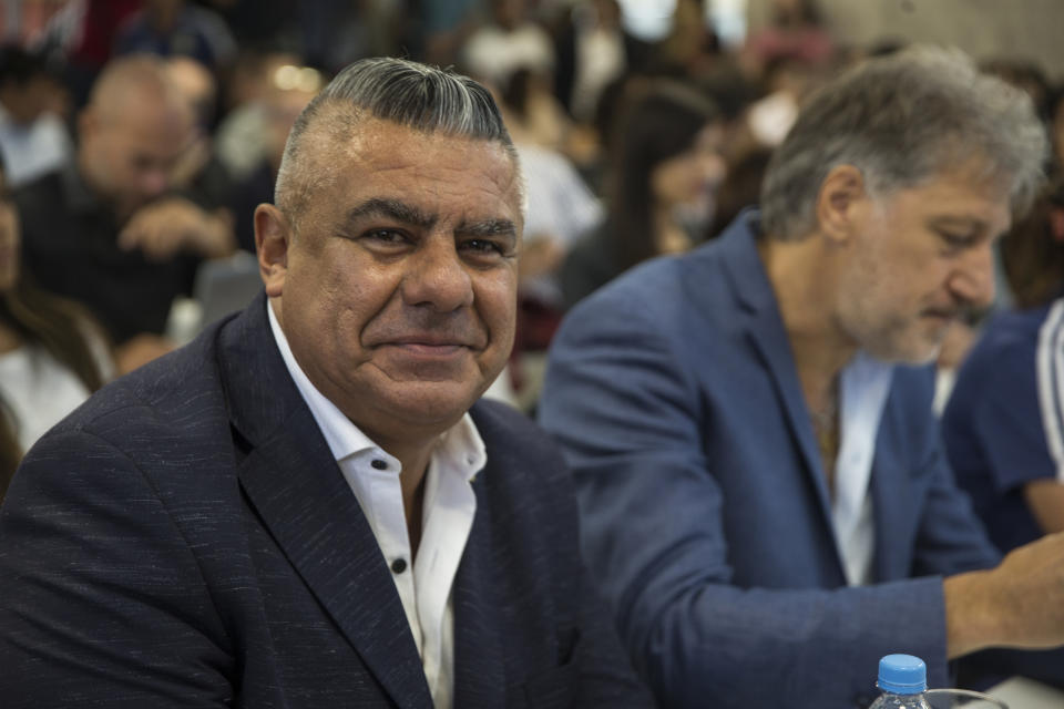 Claudio Tapia, president of Argentina's Soccer Federation, smiles as he poses for pictures during a press conference to announce the early implementation of a plan to professionalize women's soccer in Buenos Aires, Argentina, Saturday, March 16, 2019. Almost 90 years after men's soccer turned professional in Argentina, the women's game is still being played by amateur athletes who get little to no money for their work on the field. (AP Photo/Daniel Jayo)