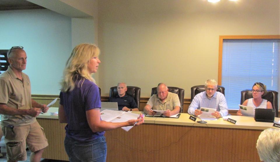 Michelle Wood, the retired program administrator at the Holmes County Soil and Water Conservation District, is seen here talking to Millersburg Village Council about a proposed logjam clearing project in the Killbuck Creek in 2021. Wood teamed with Holley Johnson to write the $5.7 million Appalachian Grant for Killbuck.