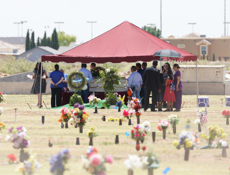 Family and friends gather for a funeral service for Jordan Anchondo at Evergreen Cemetery in El Paso, Texas on Saturday, Aug. 10, 2019. Andre and Jordan Anchondo, were among the several people killed last Saturday, when a gunman opened fire inside a Walmart packed with shoppers. Authorities say Jordan Anchondo was shielding the baby, while her husband shielded them both. (AP Photo/Jorge Salgado)