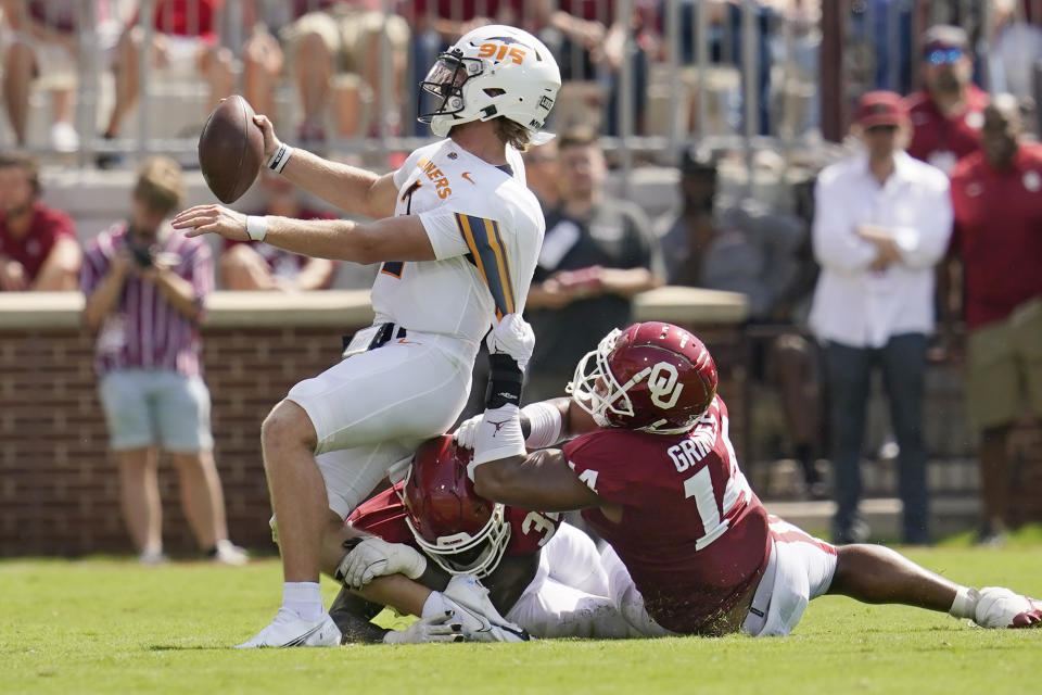 UTEP quarterback Gavin Hardison (2) is sacked by Oklahoma defensive lineman Reggie Grimes (14) in the first half of an NCAA college football game, Saturday, Sept. 3, 2022, in Norman, Okla. (AP Photo/Sue Ogrocki)