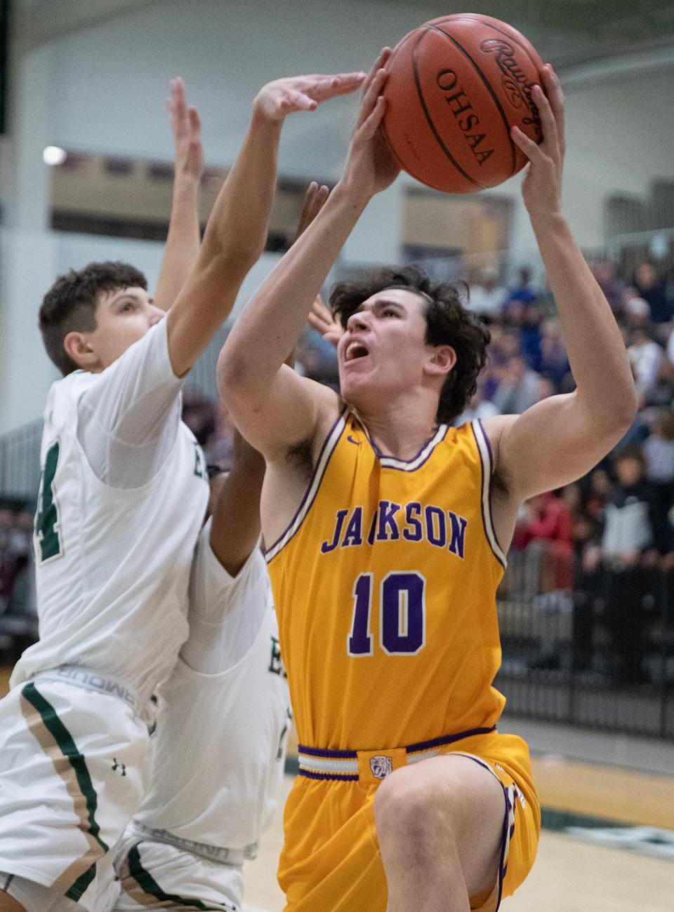 Jackson's James Bossart looks to shoot as GlenOak's Reese Zerger defends during a high school boys basketball at GlenOak on Tuesday, January 3, 2023.