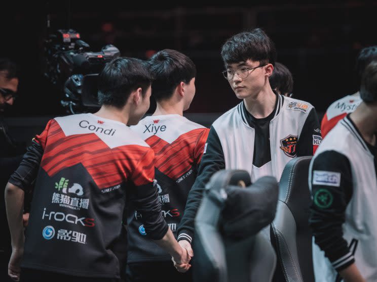 Faker shakes hands after a Group Stage loss to Team WE (lolesports)