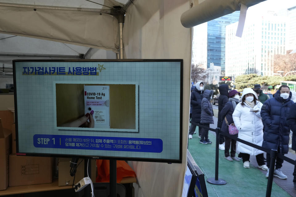 People wait for coronavirus tests outside a public health center in Seoul, South Korea, Thursday, Feb. 17, 2022. (AP Photo/Ahn Young-joon)