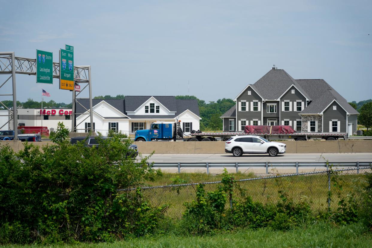 The model homes built by Georgia-based America's Home Place near Interstate-75 in Erlanger were built there intentionally to attract attention from motorists who could be potential customers.