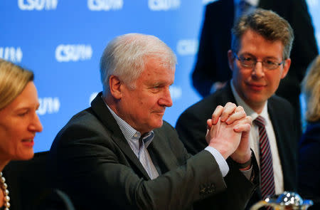 German Interior Minister Horst Seehofer gestures before a Christian Social Union (CSU) board meeting in Munich, Germany, June 18, 2018. REUTERS/Ralph Orlowski