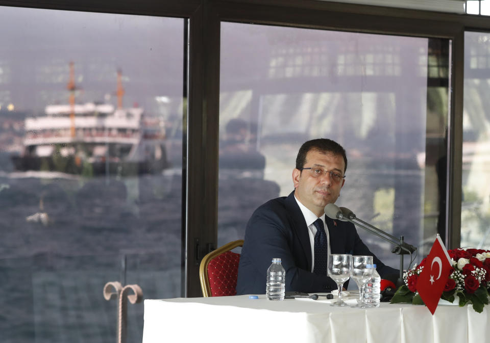 Ekrem Imamoglu, the new Mayor of Istanbul from Turkey's main opposition opposition Republican People's Party (CHP) talks to members of foreign media a day after he took over office, in Istanbul, Friday, June 28, 2019. Imamoglu said Friday he was prepared against any attempts by the government to restrict his powers while emphasizing his willingness to work with Turkish President Recep Tayyip Erdogan.(AP Photo/Lefteris Pitarakis)