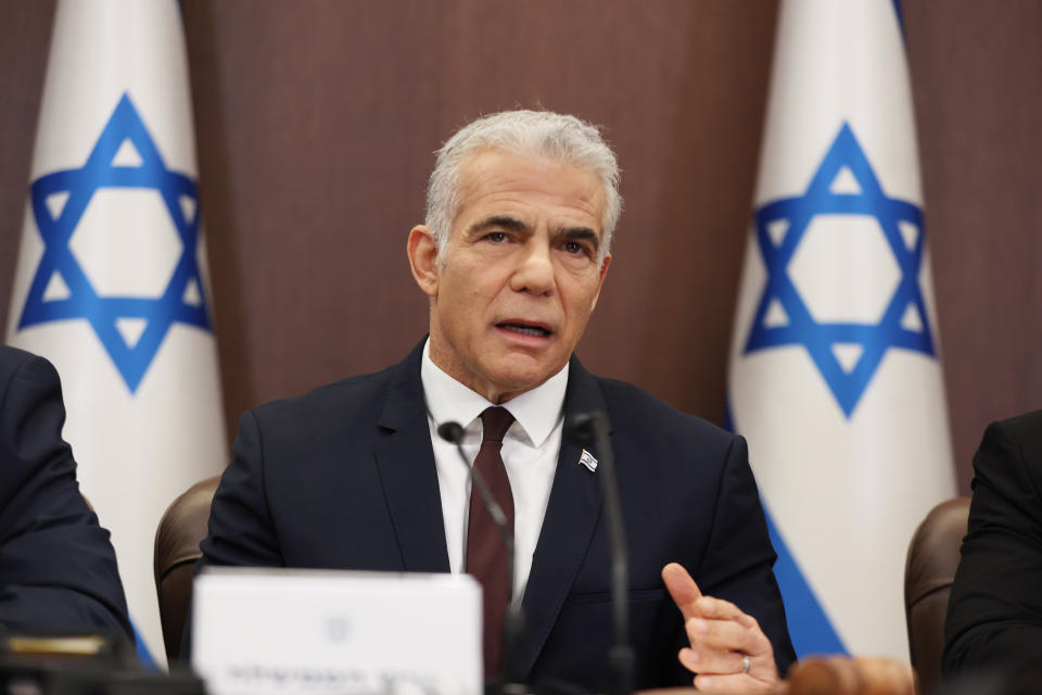 FILE - Israeli Prime Minister Yair Lapid attends a cabinet meeting at the prime minister's office in Jerusalem, Sunday, Oct. 23, 2022. Israel is holding its fifth national election in under four years, and once again the race is shaping up as a referendum on former Prime Minister Benjamin Netanyahu’s fitness to rule. (Abir Sultan/Pool Photo via AP, File)