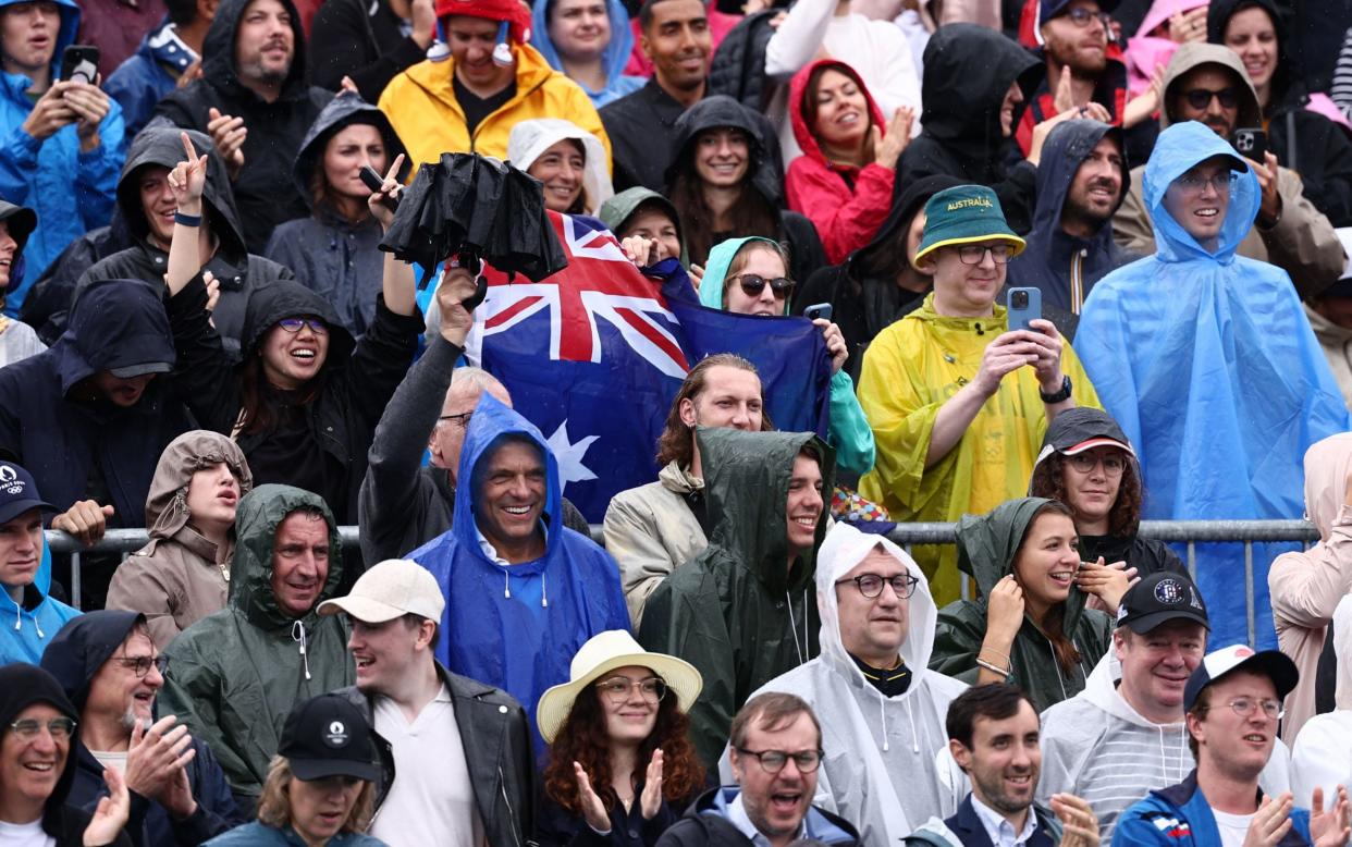 Supporters attend the beach volleyball beneath the Eiffel Tower at the Paris 2024 Olympic Games