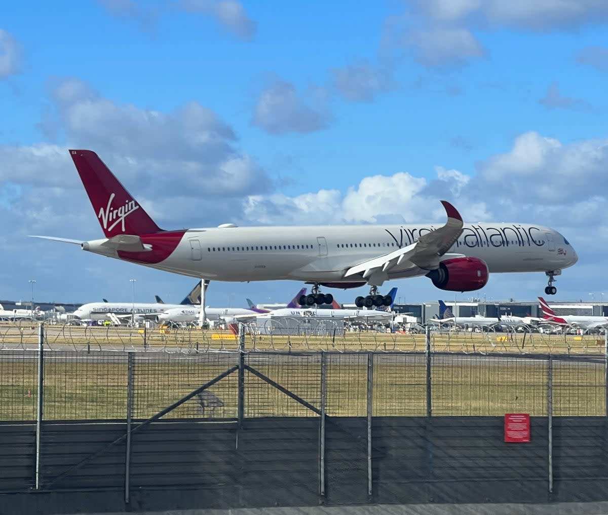 Made it: Virgin Atlantic Airbus A350 touching down at Heathrow (Simon Calder)