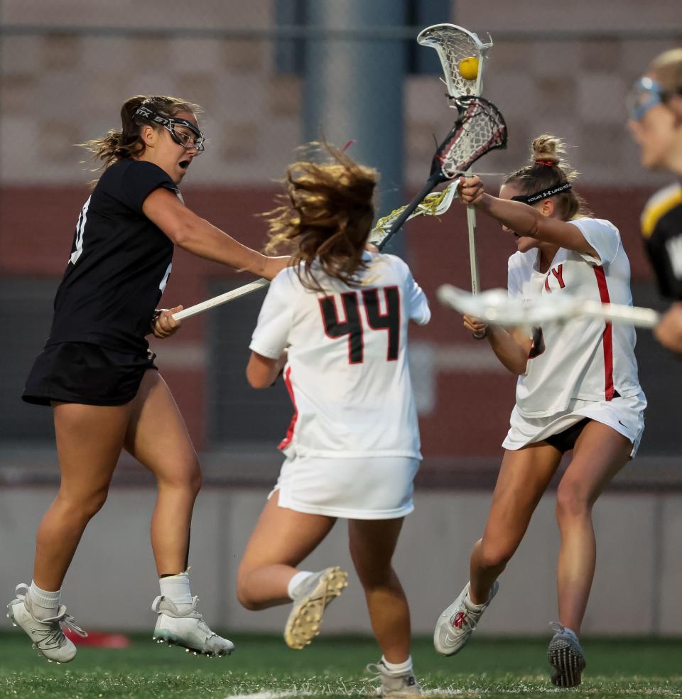 Wasatch’s Grace Erker shoots but the ball ends up in the stick of Park City’s Sierra Darling in a 5A girls lacrosse semifinal game at Westminster College in Salt Lake City on Tuesday, May 23, 2023. | Spenser Heaps, Deseret News