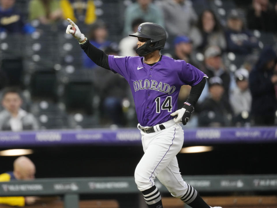 Colorado Rockies' Ezequiel Tovar gestures as he rounds the bases after he hit a solo home run off Milwaukee Brewers starting pitcher Freddy Peralta in the third inning of a baseball game Tuesday, May 2, 2023, in Denver. (AP Photo/David Zalubowski)